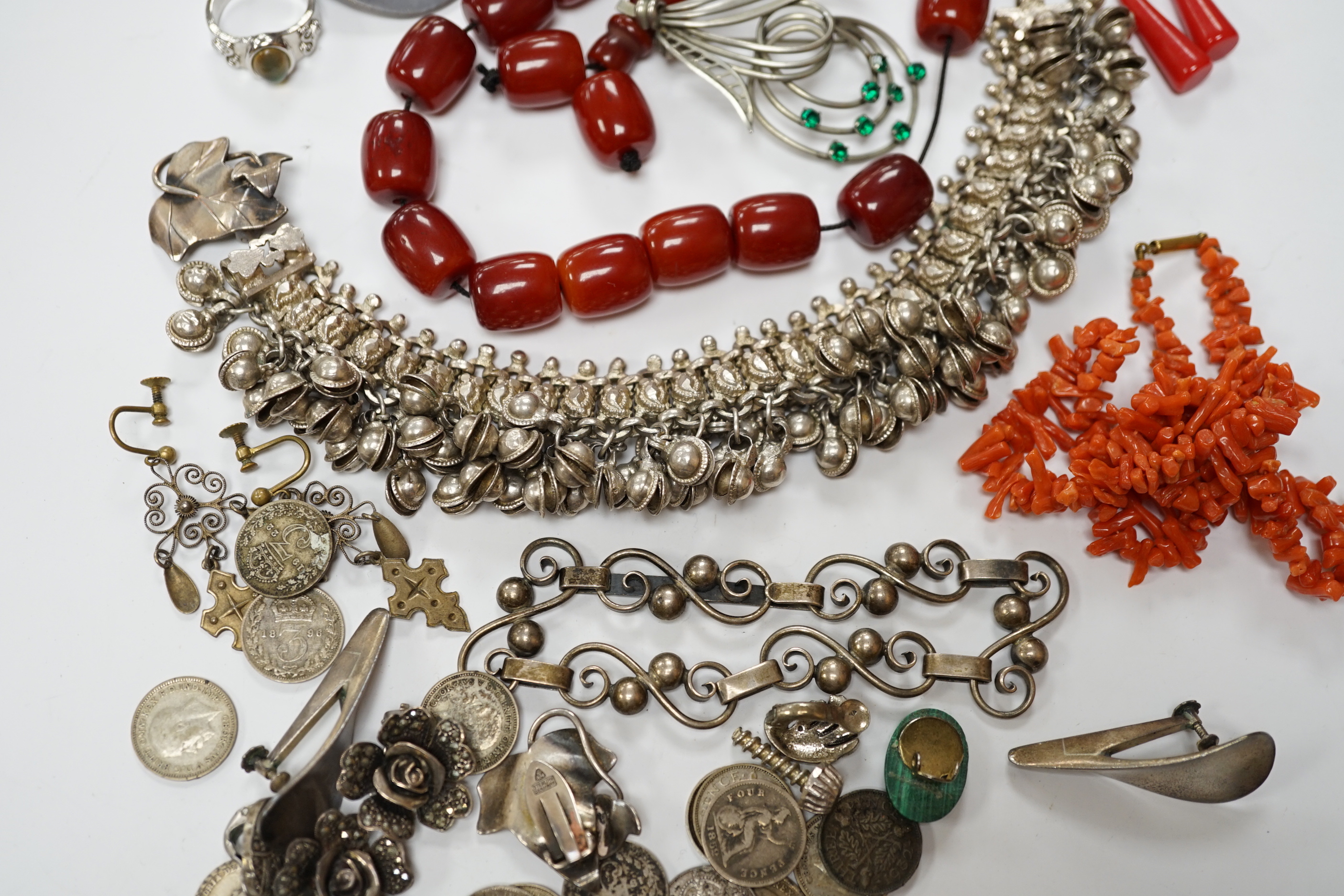 A quantity of assorted jewellery including costume, a pair of Danish sterling ear clips, a 1960's Nanna & Jorgen Ditzel for Georg Jensen sterling silver brooch, no.328, 51mm, a pair of Georg Jensen sterling ear clips, no